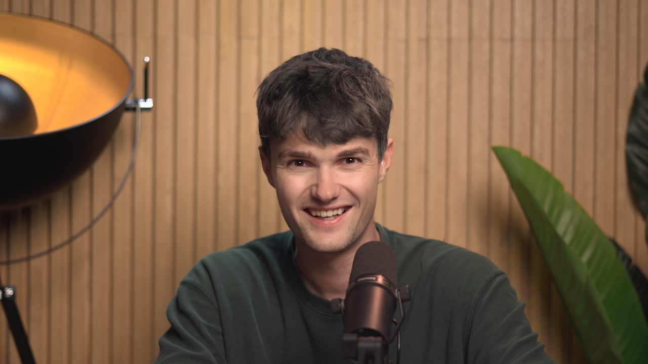 Andreas Kromann Bjærg, founder of SpeechData.ai, smiling at a studio microphone